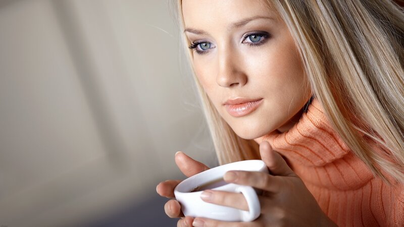 woman holding coffee cup