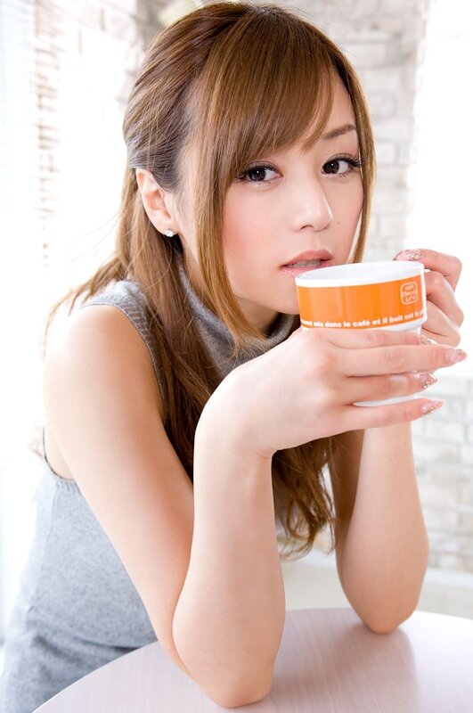 woman holding coffee cup