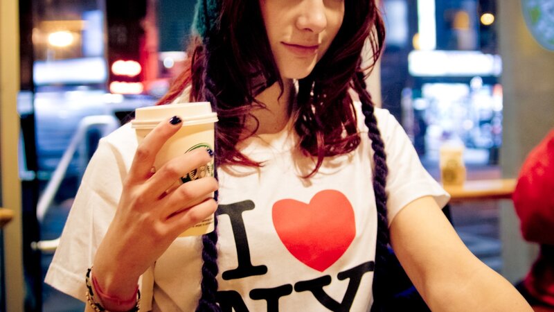 woman holding coffee cup