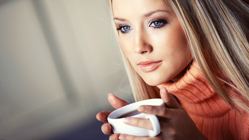 woman holding coffee cup