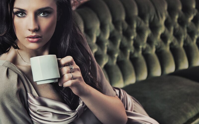 woman holding coffee cup