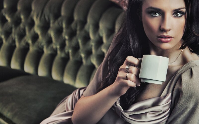 woman holding coffee cup