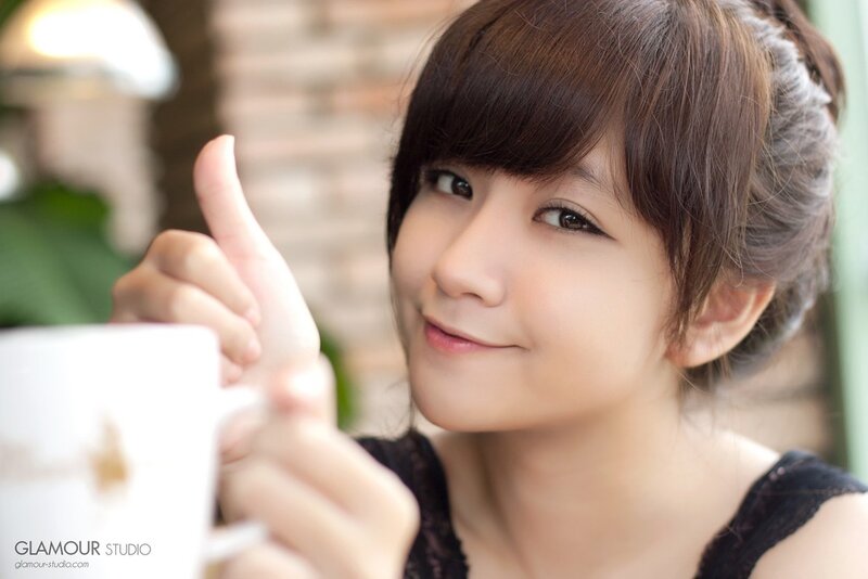 woman holding coffee cup