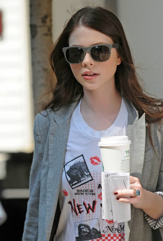 woman holding coffee cup