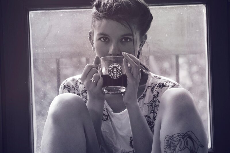 woman holding coffee cup