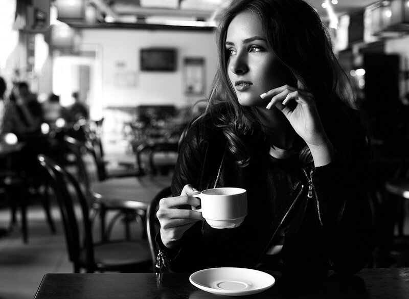 Woman Holding Coffee Cup — Black, Contemplative