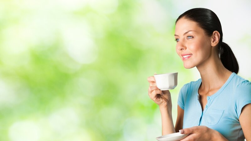 Woman Holding Coffee Cup — Green, Calm, Morning