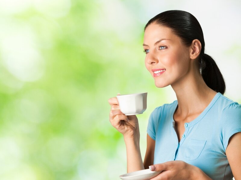 Woman Holding Coffee Cup — Green