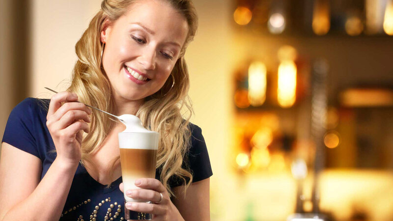 Woman Holding Coffee Drink — Brown