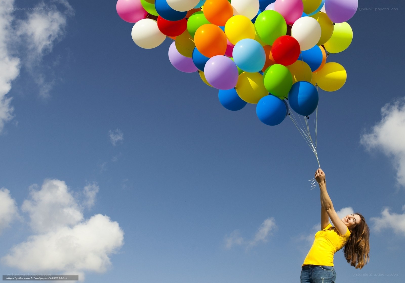Woman holding colorful balloons