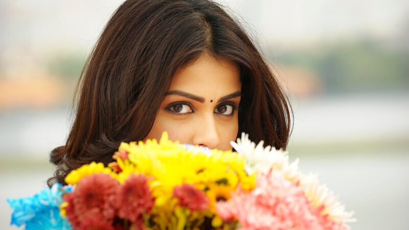 woman holding colorful flowers