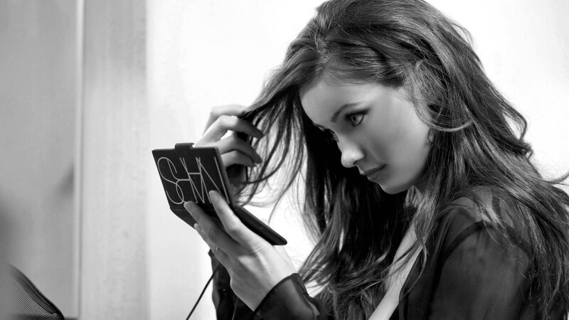 Woman Holding Compact Mirror — Black