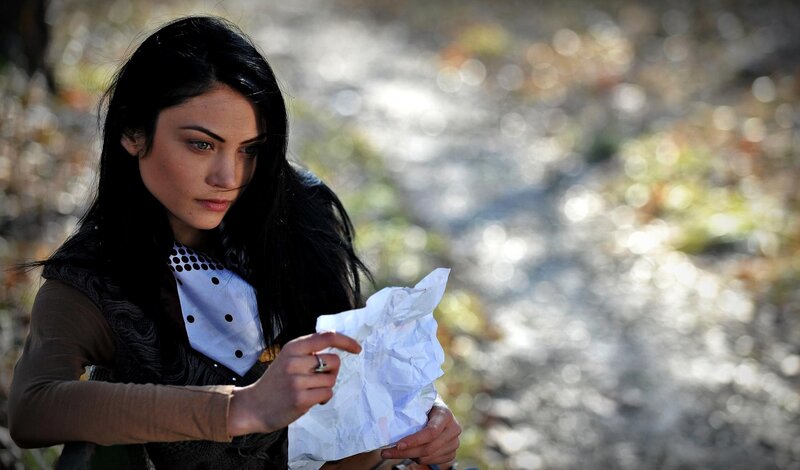 woman holding crumpled paper