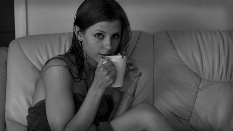 Woman Holding Cup — Black, Contemplative