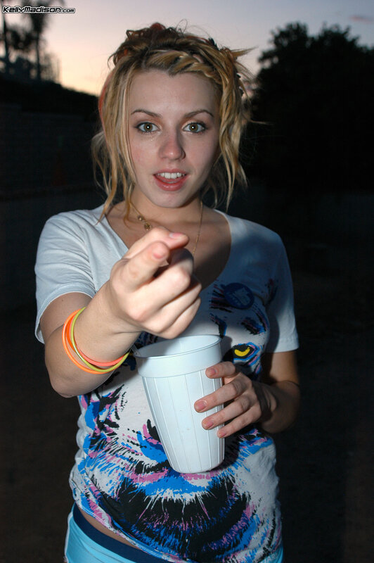 Woman holding cup outdoors