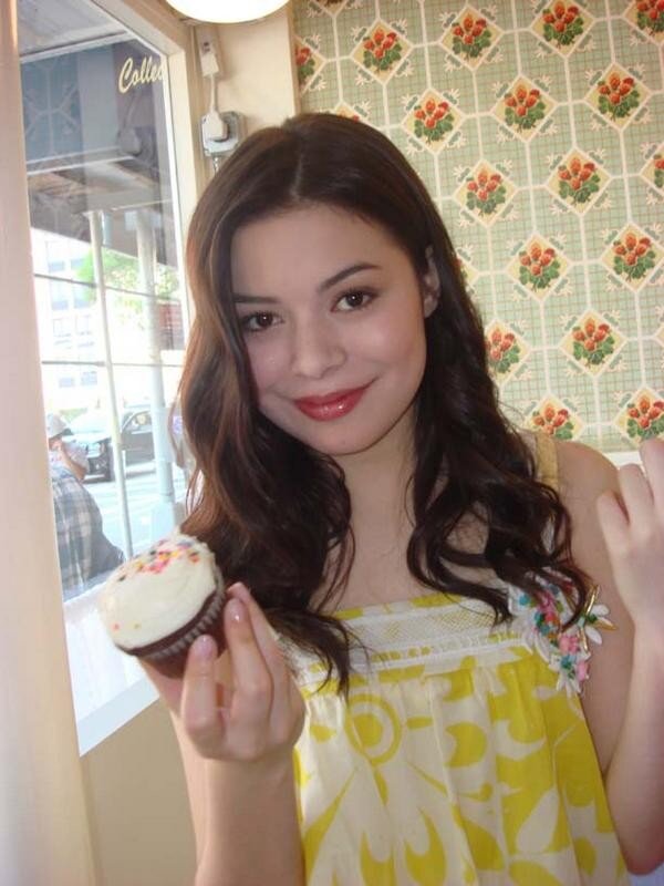 woman holding cupcake