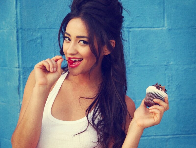 Woman Holding Cupcake — Blue