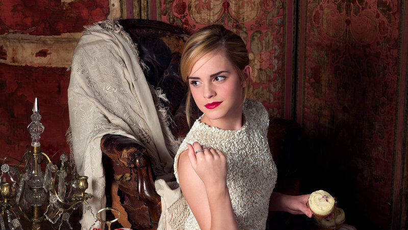 woman holding cupcake in vintage room