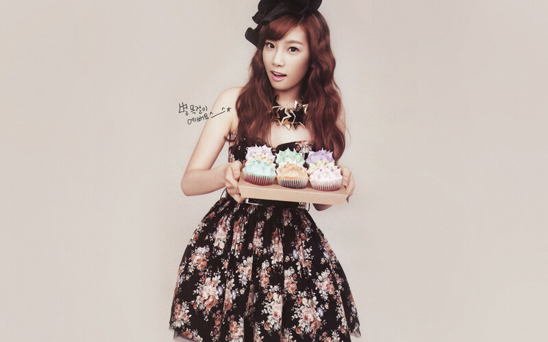woman holding cupcakes