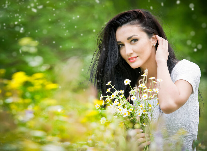 Woman Holding Daisies — White, Serene, Summer