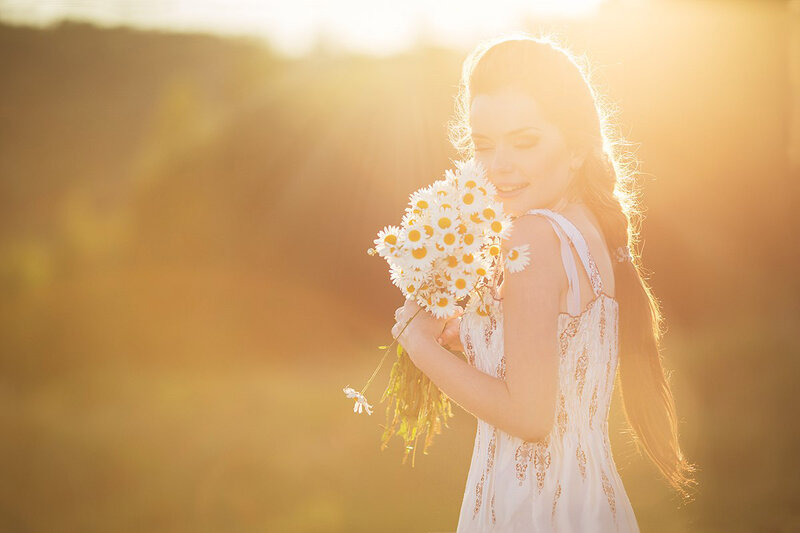 Woman Holding Daisies — White, Serene