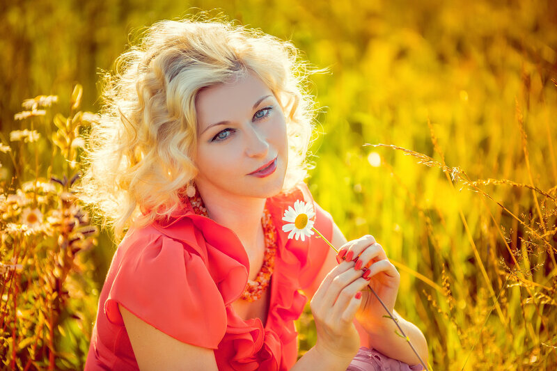 Woman Holding Daisy — Yellow