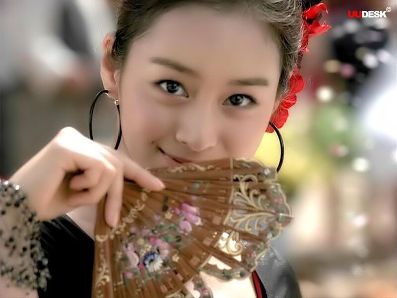 woman holding decorative fan