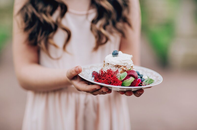 Woman Holding Dessert Plate — White
