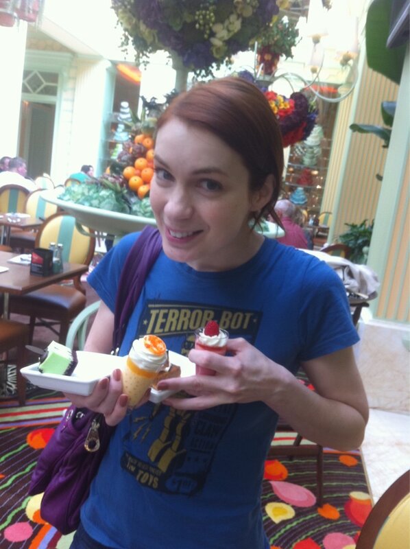 woman holding dessert tray