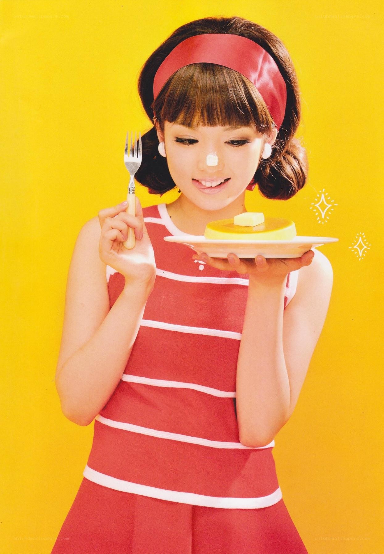 woman holding dessert with fork