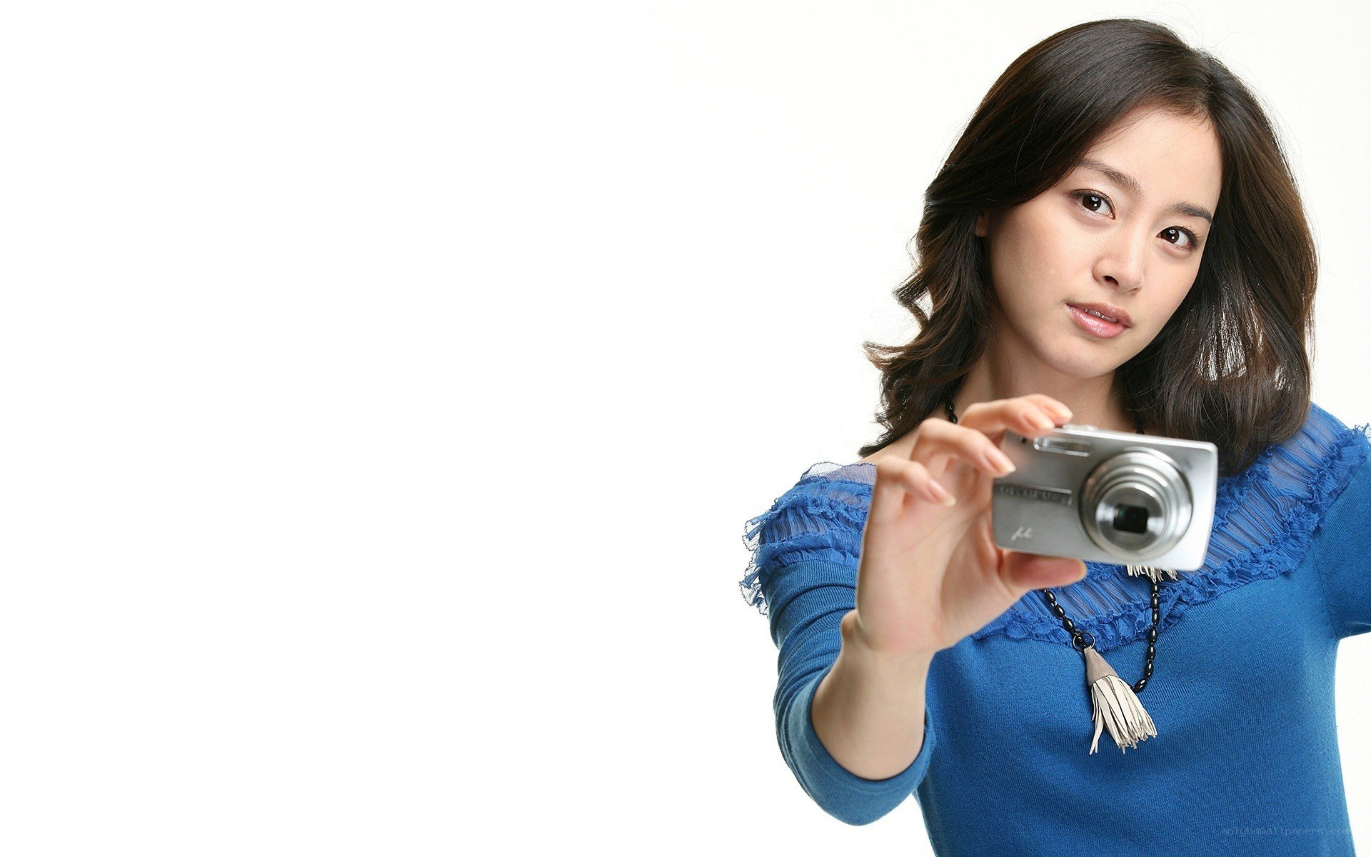 woman holding digital camera