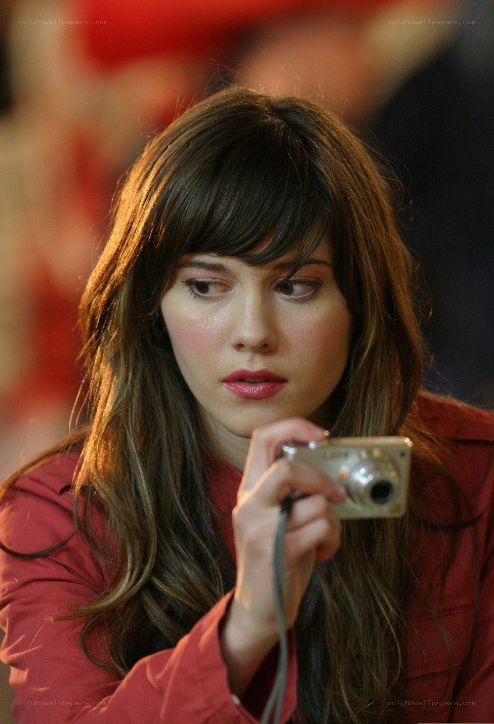 woman holding digital camera