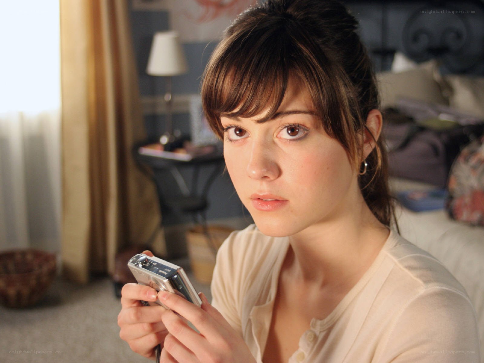 woman holding digital camera