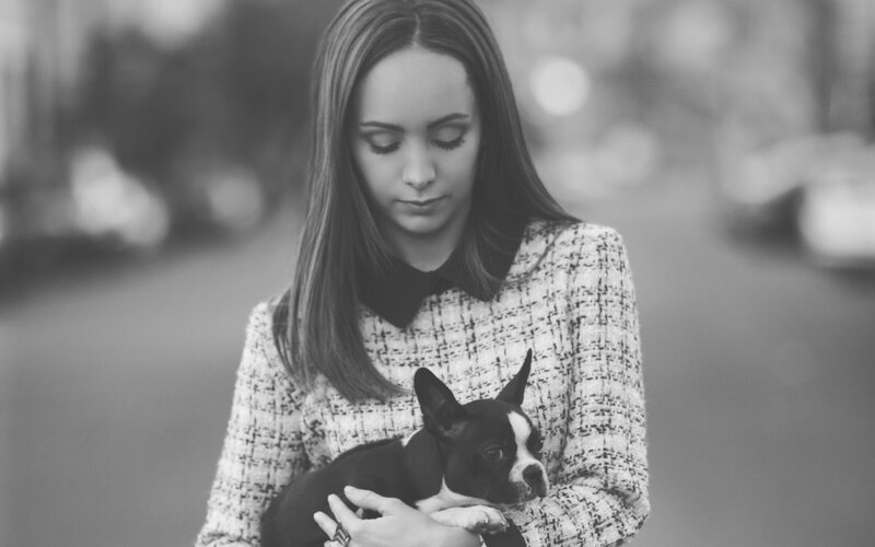 Woman Holding Dog — Black, Calm
