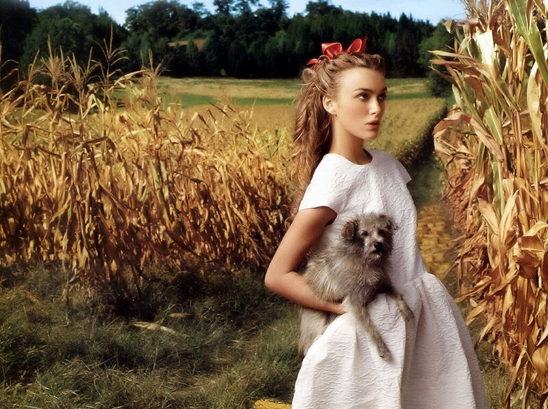 Woman Holding Dog in Field