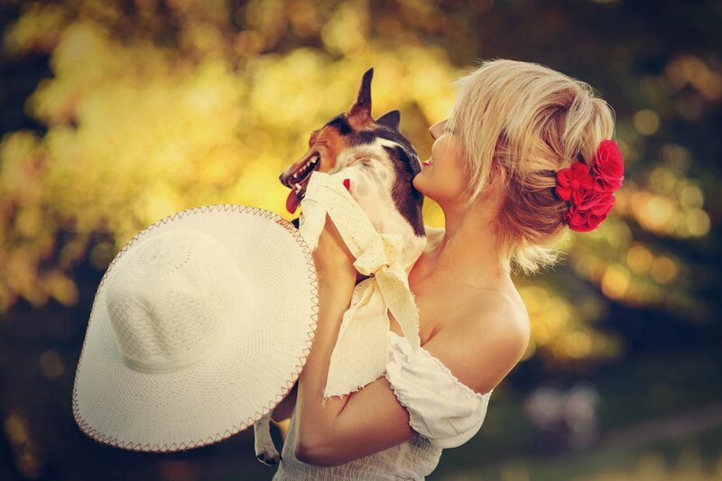 Woman Holding Dog — Yellow