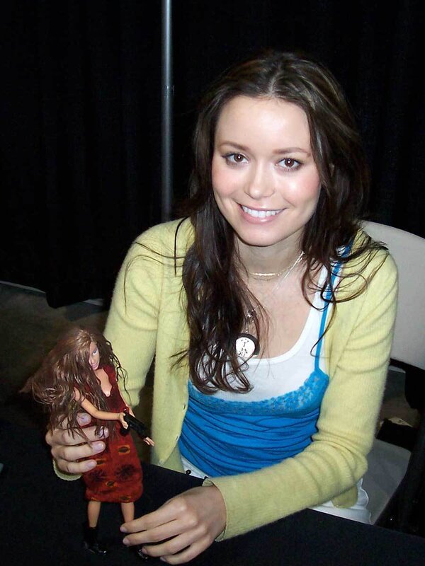 Woman Holding Doll — Yellow, Friendly