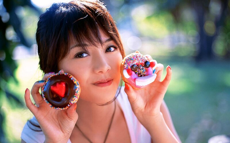 Woman Holding Donuts — Green, Playful