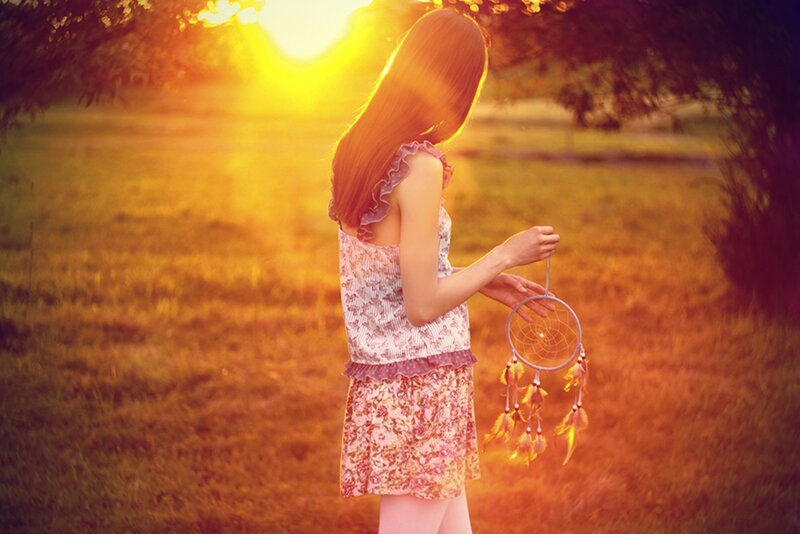 Woman Holding Dreamcatcher — Yellow