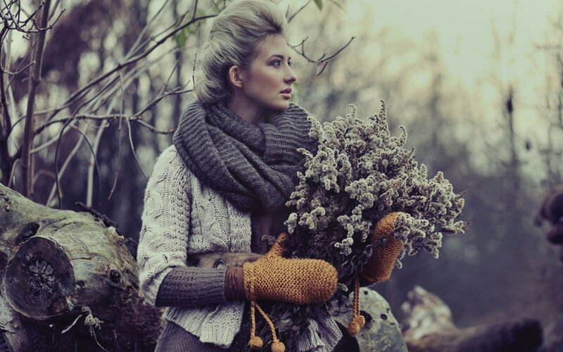 woman holding dried flowers