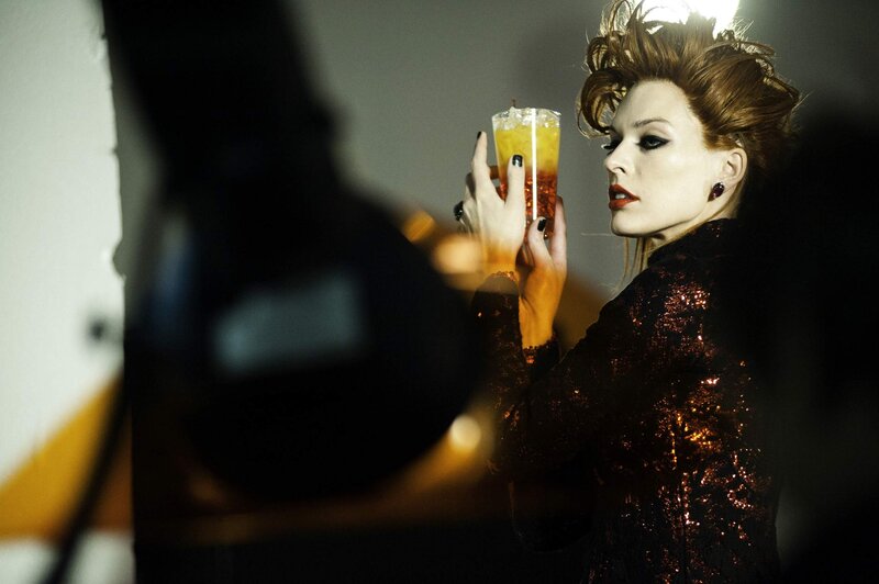 Woman Holding Drink — Black