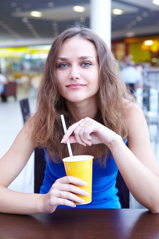 Woman Holding Drink — Blue, Calm