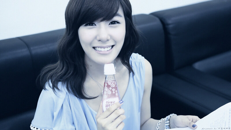 woman holding drink bottle