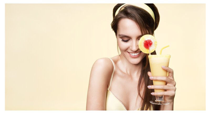 Woman Holding Drink — Yellow