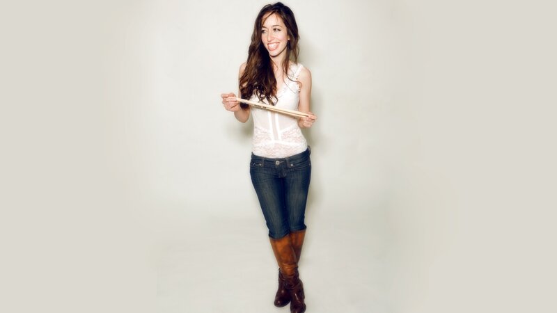 woman holding drumsticks