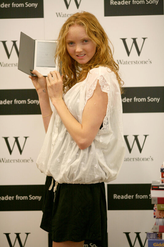 Woman holding e-reader at event
