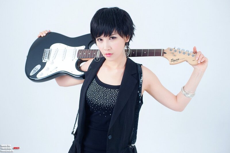 woman holding electric guitar