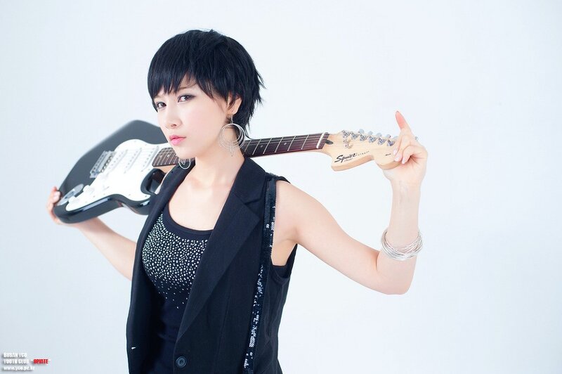 woman holding electric guitar