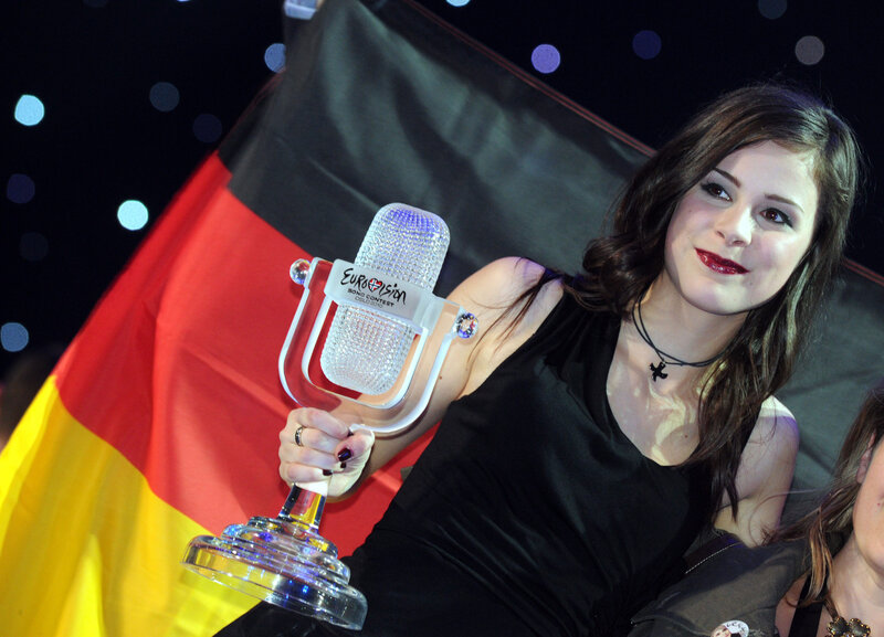 Woman holding Eurovision trophy