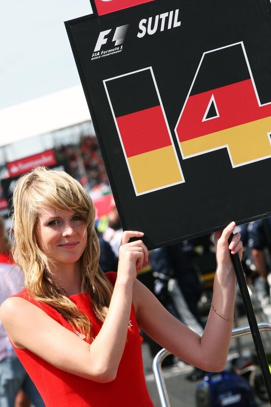 Woman holding F1 sign